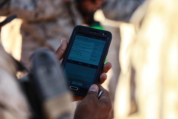 A Marine with Fox Company, 2nd Battalion, 7th Marine Regiment tests out the instant messaging function on a tablet device at Marine Corps Air Station Yuma, Arizona, Oct. 14, 2015. Photo By: Lance Cpl. David Staten