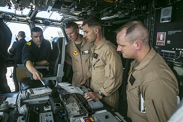 U.S. Marine pilots coordinate air movements with the Spanish Navy aboard Spanish amphibious assault ship Juan Carlos I during deck landing qualifications. (U.S. Marine Corps/Staff Sgt. Vitaliy Rusavskiy)