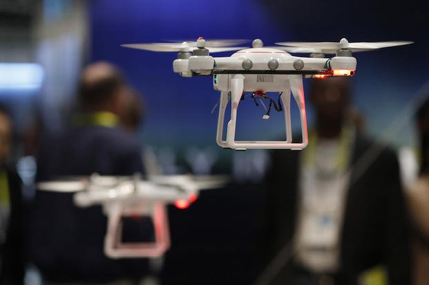 Drones fly at the Autel booth during the International CES Wednesday, Jan. 7, 2015, in Las Vegas. (AP Photo/John Locher)