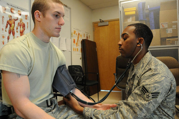Ohio Air National Guard Senior Airman Bruce Moman, an Aerospace Medical Services Journeyman from the 180th Fighter Wing Medical Group, takes the blood pressure of a patient as part of an annual physical health assessment. U.S. Air Force photo