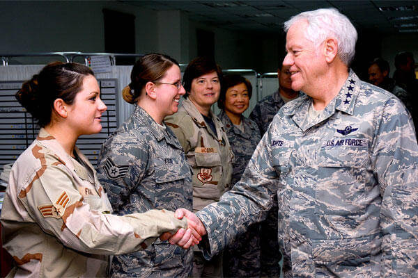 Gen. Arthur J. Lichte greets Air Force personnel at a Southwest Asia air base in January 2008. (US Air Force/Tia Schroeder)