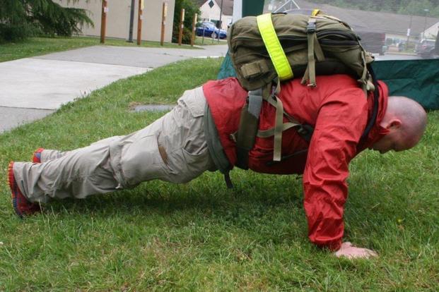 During a recent 10K remembrance run, a sailor stopped every mile to do 22 pushups, squats or military press with a ruck sack in a gesture to remember the 22 veterans on average who die by suicide each day. (Photo by Douglas Stutz/U.S. Navy)
