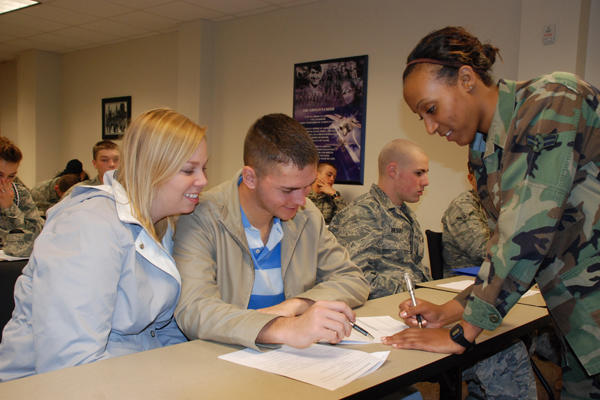 Couple in a discussion with a soldier.