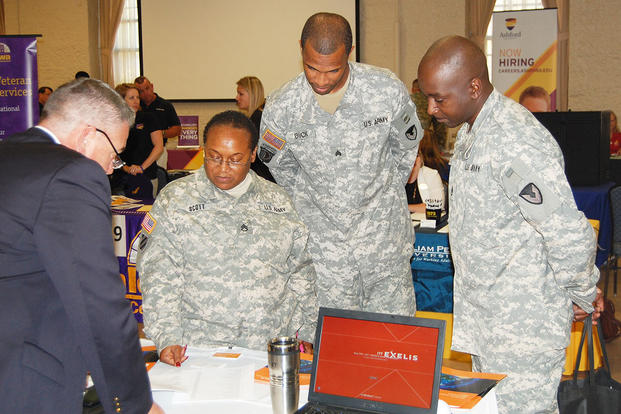 Non-commissioned officers receive information from an employer at a U.S. Army Garrison Rock Island Arsenal Employment and Education Event