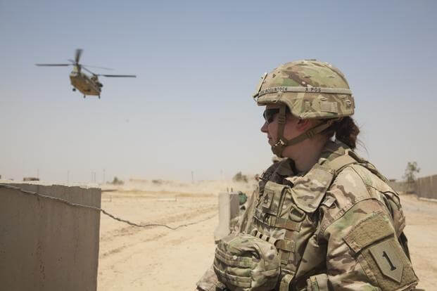 U.S. Army Staff Sgt. Heidi McClintock, deployed in support of Combined Joint Task Force-Operation Inherent Resolve and assigned to the Main Command Post Operational Detachment, 1st Infantry Division, waits for a CH-47 Chinook to land at a tactical assembly area near Mosul, Iraq, May 29, 2017. More than 60 Coalition partners have committed themselves to the goal of eliminating the threat posed by ISIS in Iraq and Syria and have contributed in various capacities to the effort. CJTF-OIR is the global Coalition