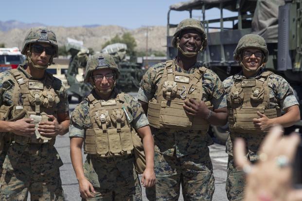 Marines with 3rd Light Armored Reconnaissance Battalion pose for a spectatorâs photo during the 67th annual Grubstake Days Parade along California Highway 62 in Yucca Valley, Calif., May 27, 2017.