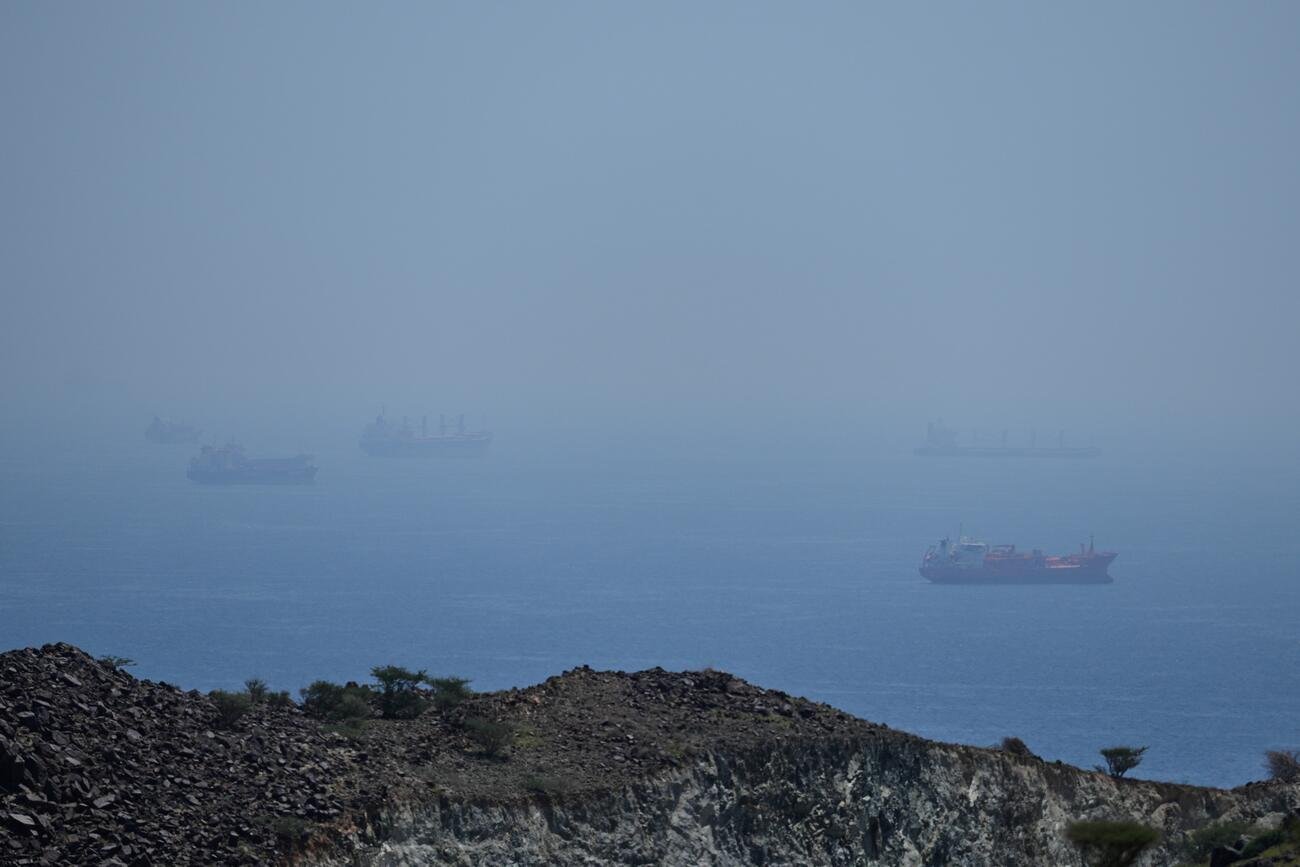 Military ship in the Strait of Hormuz during sunset