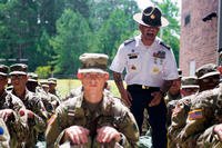 A U.S. Army Drill Sergeant assigned to Foxtrot 1st Battalion 34th Infantry Regiment directs trainees on the First day of Basic Combat Training on June 12, 2017 at Fort Jackson, SC. (U.S. Army photo/Spc. Darius Davis)