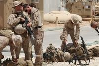 U.S. Marines attached to Task Force Al Asad with 1st Battalion, 7th Marine Regiment, Special Purpose Marine Air-Ground Task Force-Crisis Response-Central Command, prepare to assume their security positions while at Al Asad Air Base, Iraq, July 5, 2017. (U.S. Marine Corps photo/Dave Williams)