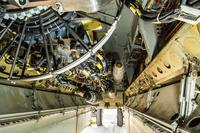 A B-52 bomber sits on a flightline with munitions loaded on a newly installed conventional rotary launcher in its bomb bay, at Al Udeid Air Base, Qatar, on Nov. 17, 2017. The CRL will allow the B-52 to carry more smart bombs.