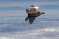 FILE -- A U.S. Air Force F-22 Raptor deploys counter measure flares during a training sortie, June 16, 2014. (U.S. Air Force/Tech. Sgt. Jason Robertson/Released)