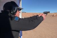 Darin Scott, commercial and law enforcement sales director for Colt,  fires the Colt Night Cobra at SHOT Show 2018 in Las Vegas. Hope Hodge Seck/Military.com