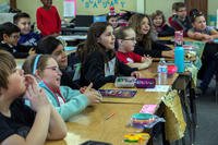 Students of Friendly Hills Elementary School listen to a Marine with Marine Training Unit read books to them at Friendly Hills Elementary School in Joshua Tree, California. (U.S. Marine Corps/Cpl. Francisco J. Britoramirez)