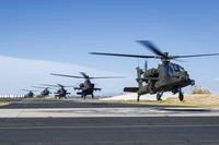 A flight of five U.S. Army AH-64 Apache helicopters takes off.  (US Army photo)