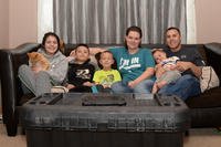 Tech. Sgt. Brian Thomas and Tech. Sgt. Leah Thomas sit for a family photo at their home in Box Elder, S.D. Brian and Leah have been foster parents for more than four years and have housed over 40 children. (U.S. Air Force/Nicolas Z. Erwin)