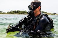 A SEAL team member conducts proof of concept and operational testing and evaluation of tactics, techniques and procedures development during exercise TRIDENT 17 on Hurlburt Field, Fla.