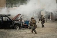 Members of Fox Company, 2nd Battalion, 4th Marine Regiment, and 1st Intelligence Battalion, 1st Marine Division, survey a simulated attack zone during the Infantry Integration with Counterintelligence/Human Intelligence Operations (CI-HUMINT) (TACEX 19.2) at Camp Pendleton, California, on March 21, 2019. (Marine Corps photo by Lance Cpl. Alexa Hernandez)