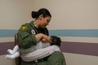 A sailor breastfeeds her child in the lactation room at Naval Support Facility Arlington on June 6, 2019. (U.S. Navy Photo by Mass Communication Specialist 2nd Class Tyler Preston)