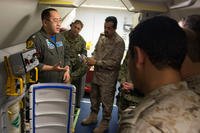 Lt. Fan Yang, left, a tactical coordinator assigned to Patrol Squadron (VP) 5, demonstrates the systems onboard a P-8A Poseidon aircraft to members of the Royal Saudi Naval Forces. (U.S. Navy photo/Jakoeb Vandahlen)