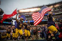 U.S. Naval Academy midshipmen run onto Lincoln Financial Field prior to the Army-Navy football game, Dec. 14, 2019, in Philadelphia, Pa. (U.S. Army photo/Erik Estrada)