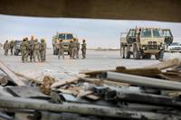 U.S. Soldiers from the 206th Engineering Battalion, U.S. Airmen and KBR Inc. civilian contractors remove debris from recent missile attacks at Al Asad Air Base, Iraq, Jan. 12, 2020. (U.S. Army/Spc. Derek Mustard)
