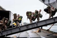 Marines embark aboard the USS Bataan.