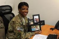 mother holding pictures of her family