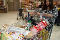 woman with full grocery cart