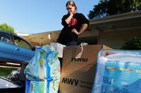 A Navy dependent looks over household items.