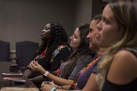 group of spouses listening to presentation