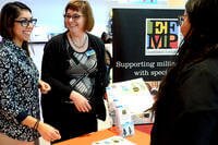 women standing around an efmp display