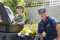 coast guardsman and child outside