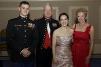 two couples in formal wear at the birthday ball