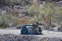 A test facility professional prepares to fire an M72 LAW Fire from Enclosure test round at an undisclosed test range in 2019.