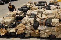 More than 30,000 pounds of pure cocaine sit on a pier.