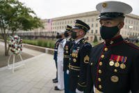 An honor guard stand at attention during the Pentagon 9/11 Observance Ceremony at the Pentagon Memorial, Washington D.C., Sept. 11, 2020. The ceremony was held in honor of the 184 people killed at the Pentagon during the Sept. 11, 2001 attacks. (Carlos M. Vasquez II/Navy)