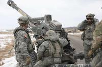 Soldiers from the 10th Mountain Division, man their gun lines.