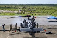 Crews watch the firing of the GAU-18 .50 caliber machine gun.