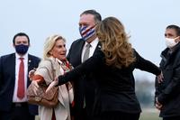 Secretary of State Mike Pompeo and his wife Susan embrace U.S. Ambassador to France Jamie McCourt.