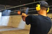 Coast Guard seaman practices his marksmanship