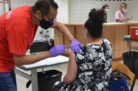 Soldiers and civilians receive COVID vaccine in Wiesbaden, Germany.