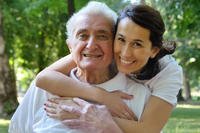 woman hugging older man