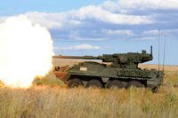 Stryker equipped with a mobile gun system fires a round of high explosive ammunition