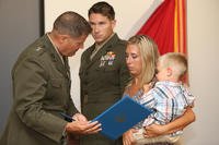 The family of a gunnery sergeant killed in action receives Navy Cross.