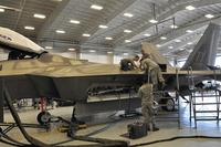 Air Force maintainers address an issue on an F-22 Raptor