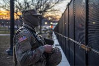 National Guard soldier stands guard at Capitol.