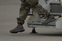 Members of the British armed forces 16 Air Assault Brigade walk to the air terminal.