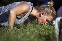 How do women develop upper-body strength to do push-ups?