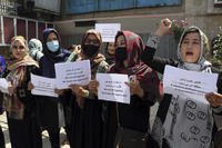 Women gather to demand their rights under the Taliban rule