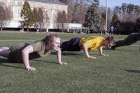 Navy ROTC cadets work out.